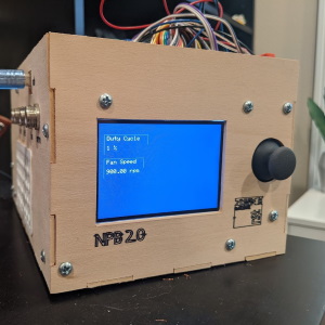 a box made of balsa wood with an LCD screen, the top is open revealing wires and circuit boards