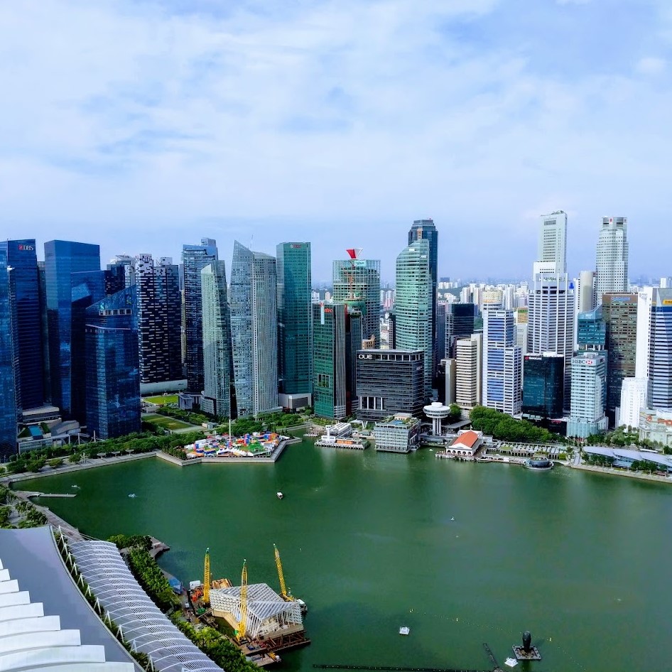 a skyline of tall buildings in front of a bay